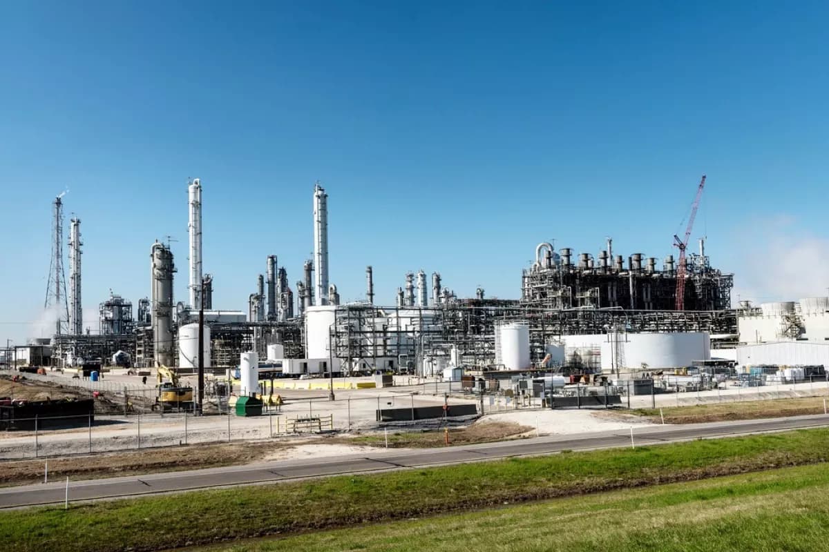 An oleochemical plant under open sky, columns and storage tanks in daylight
